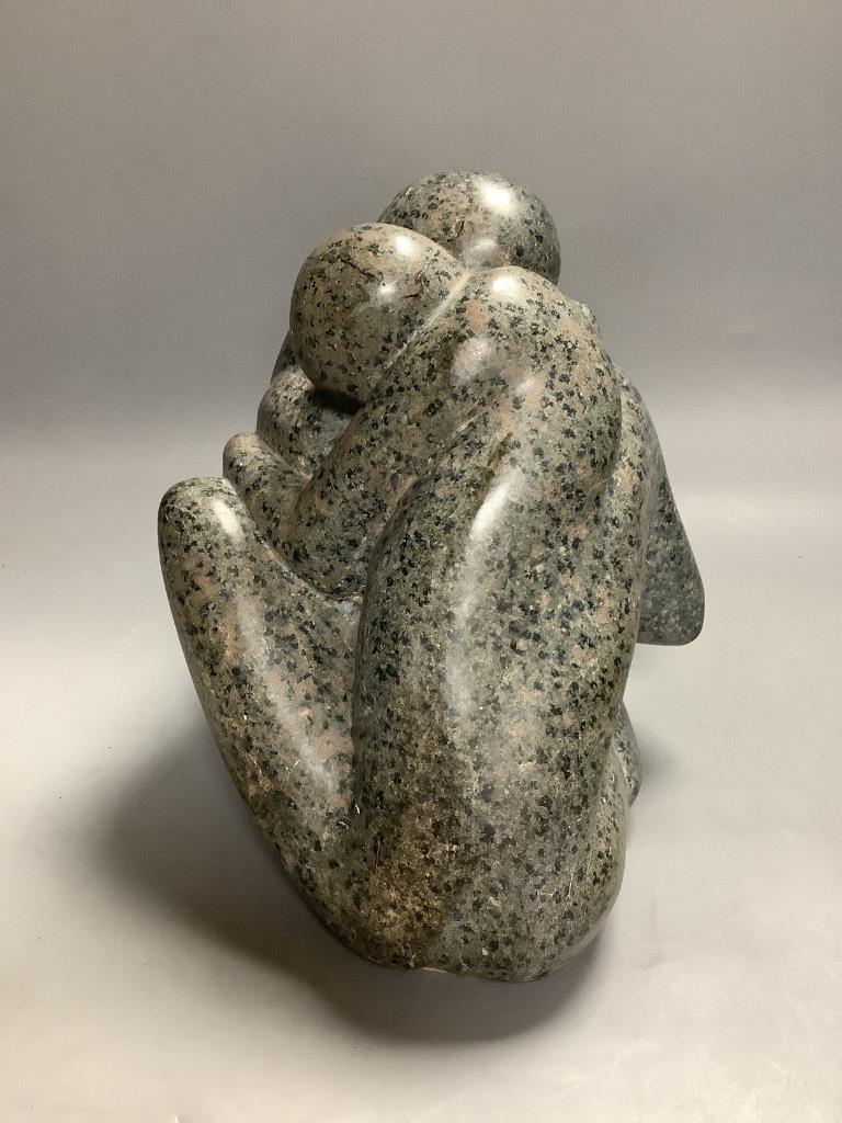 Modern British, a carved granite group of an embracing couple, initialled JMB?, height 26cm